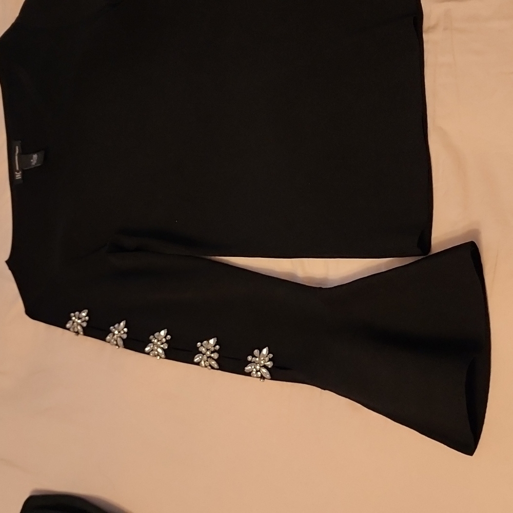 Beautiful black bell sleeve top with studs on sleeves